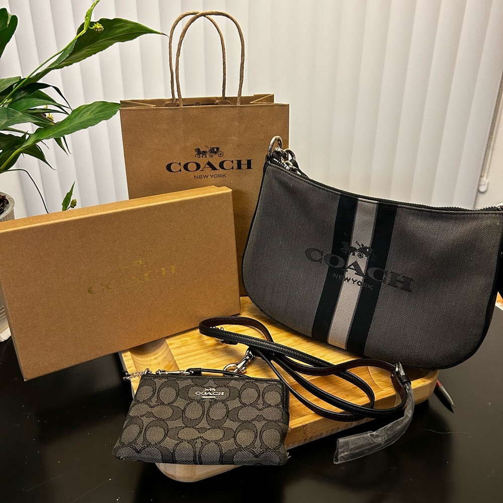 Coach cross body purse with long strap and bonus wristlet.
